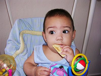 Mimi eating crackers and watching Elmo